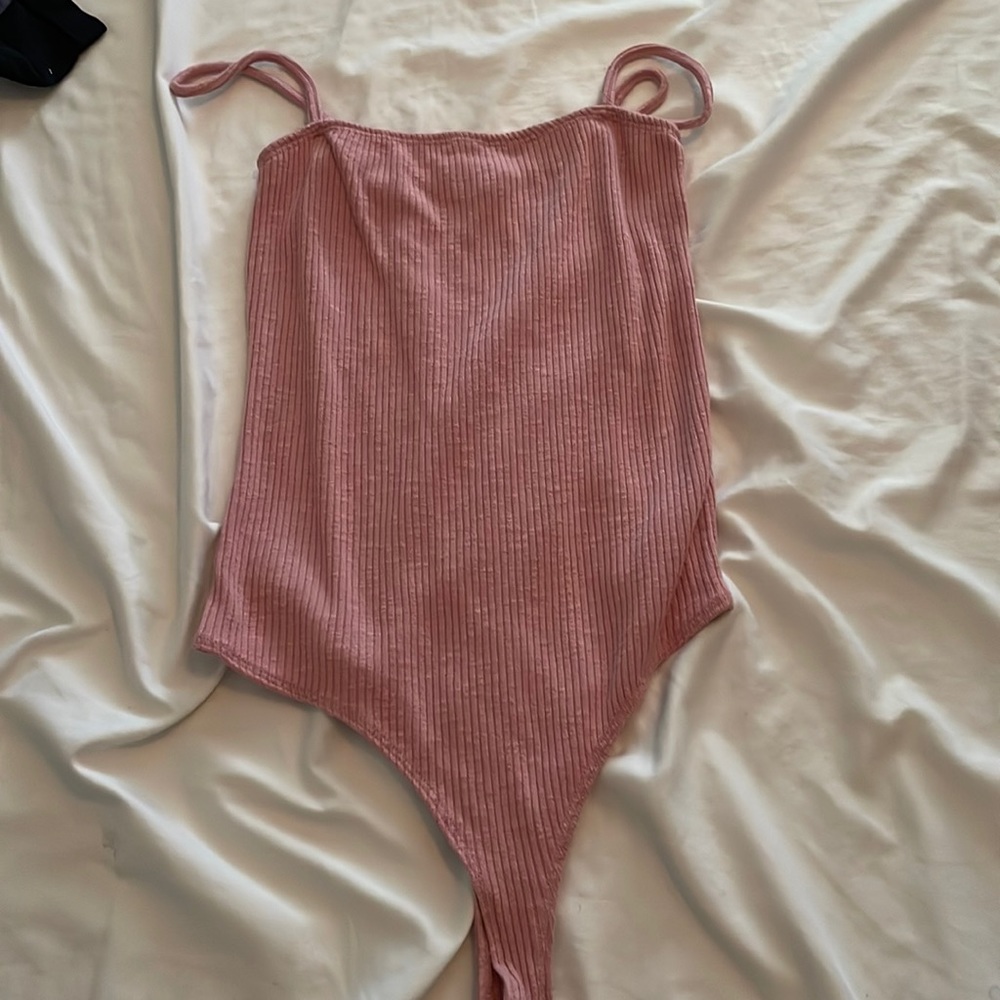 Pink body suit